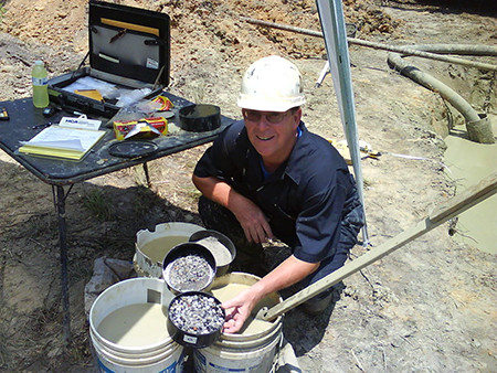 Sieve Shows Gravel, Fine Gravel and Sand (Front to Back) Collected from the Project's Primary Aquifer